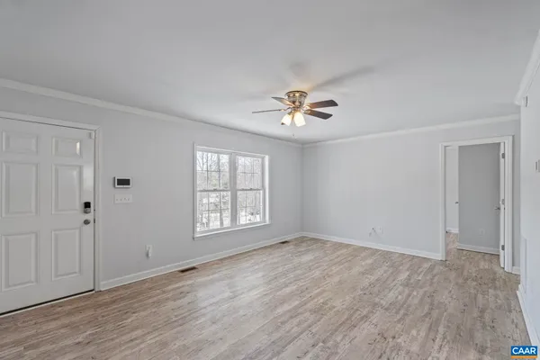 a view of an empty room with a window