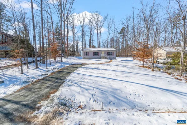 a view of a fountain with tree in the background