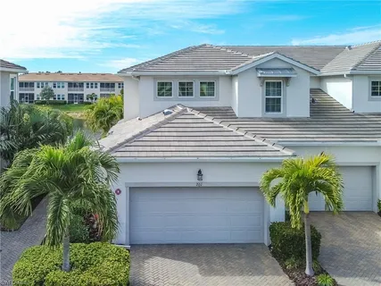 a view of a garden with a bench in the garden