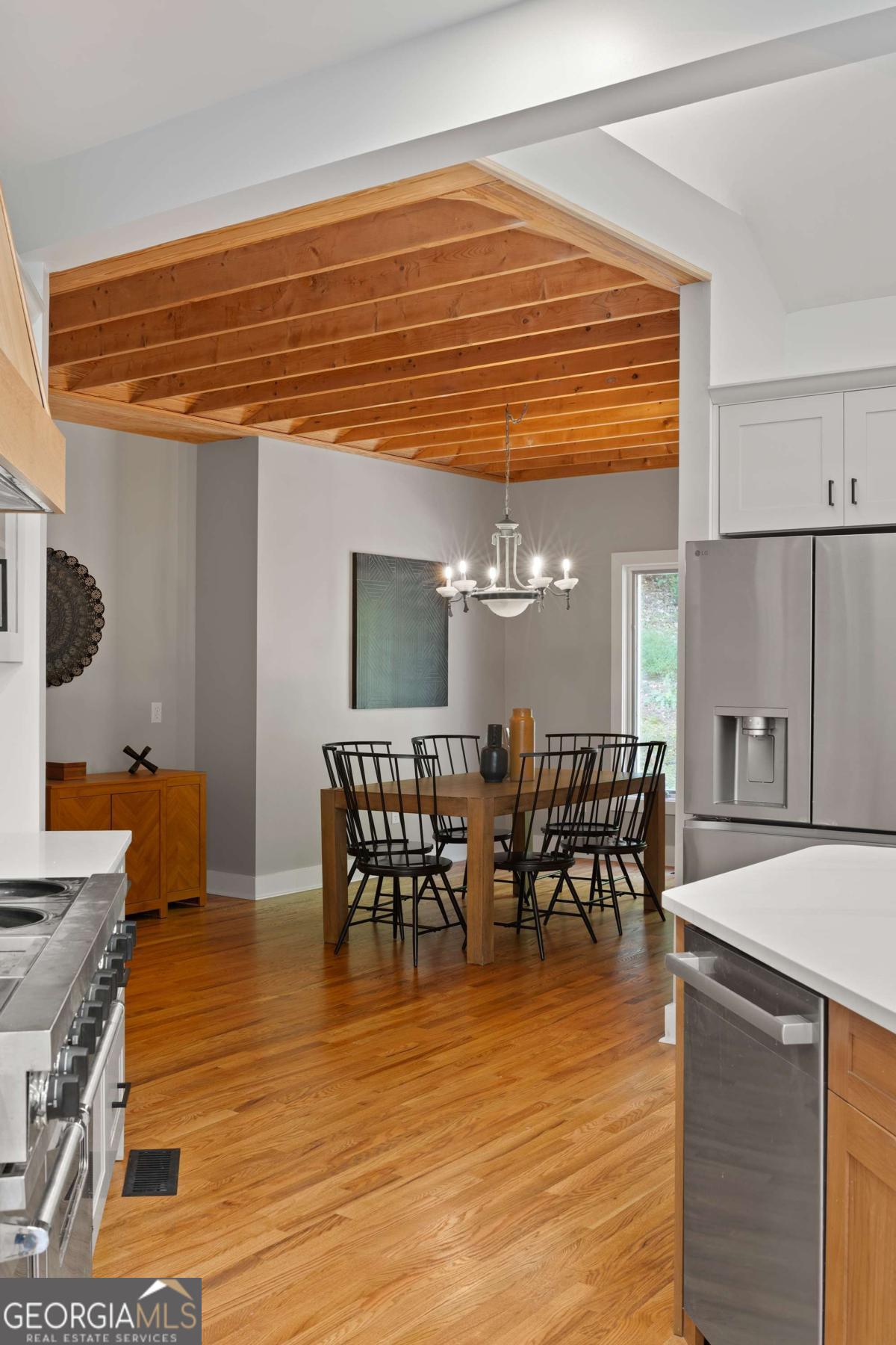 134 Tanner Bluff Athens, GA 30606 - Photo 17 of 45 a dining hall with stainless steel appliances granite countertop a table chairs and a wooden floor