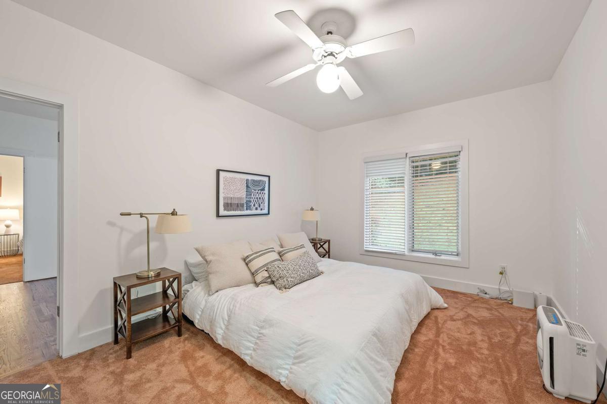 134 Tanner Bluff Athens, GA 30606 - Photo 21 of 45 a bedroom with a bed and a chandelier