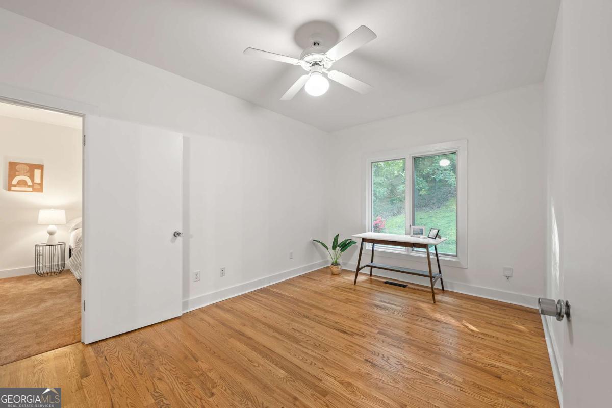 134 Tanner Bluff Athens, GA 30606 - Photo 22 of 45 an empty room with wooden floor and windows