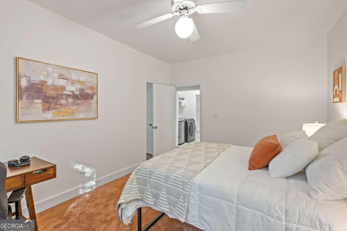 134 Tanner Bluff Athens, GA 30606 - Photo 24 of 45 a bedroom with a bed and a chandelier