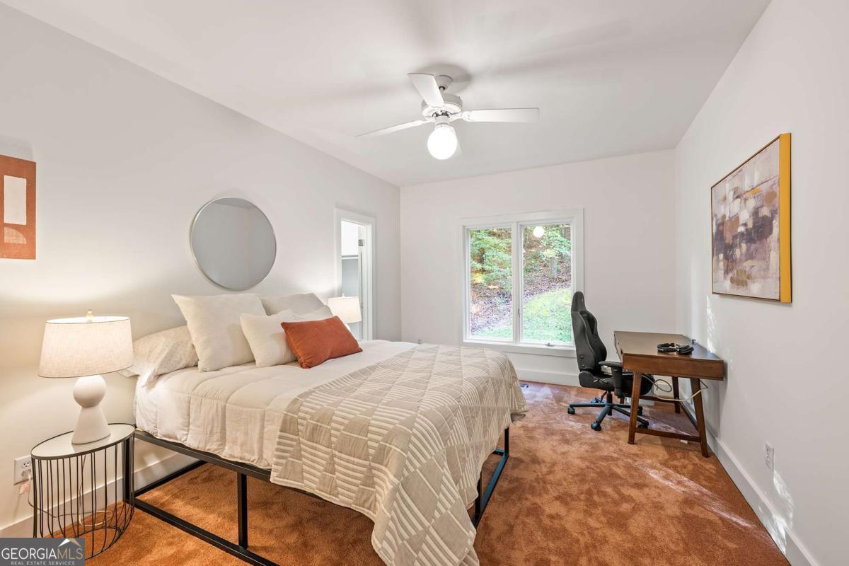 134 Tanner Bluff Athens, GA 30606 - Photo 25 of 45 a bedroom with a bed and a chandelier