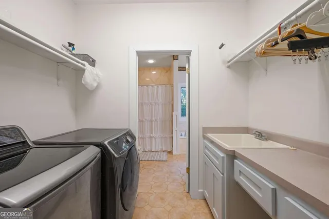 a utility room with dryer and washer