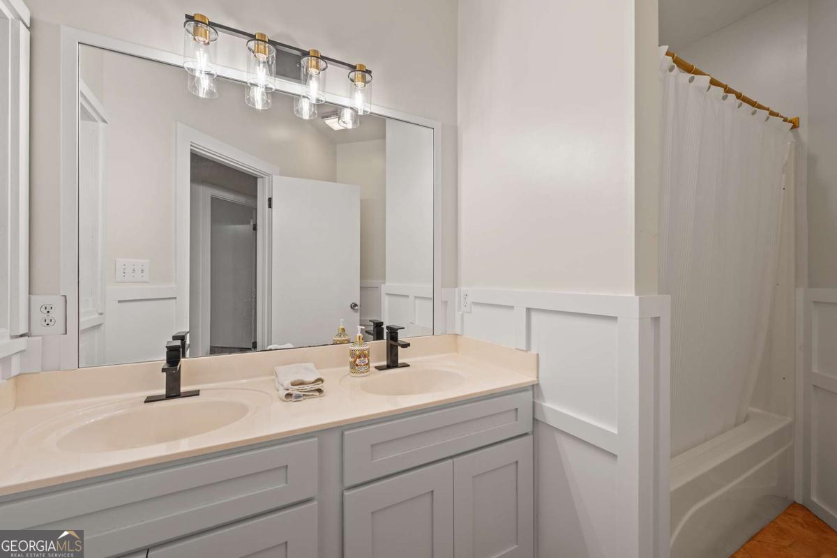 134 Tanner Bluff Athens, GA 30606 - Photo 27 of 45 a bathroom with a sink and a mirror
