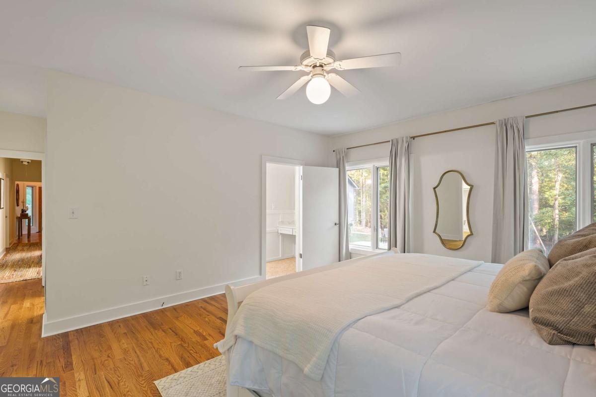 134 Tanner Bluff Athens, GA 30606 - Photo 29 of 45 a bedroom with a bed and a chandelier