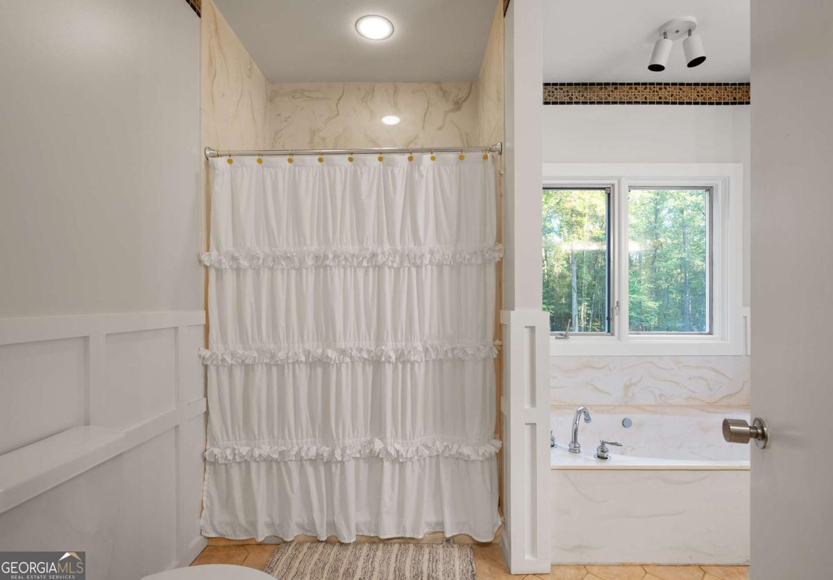 134 Tanner Bluff Athens, GA 30606 - Photo 33 of 45 a bathroom with a bathtub and shower