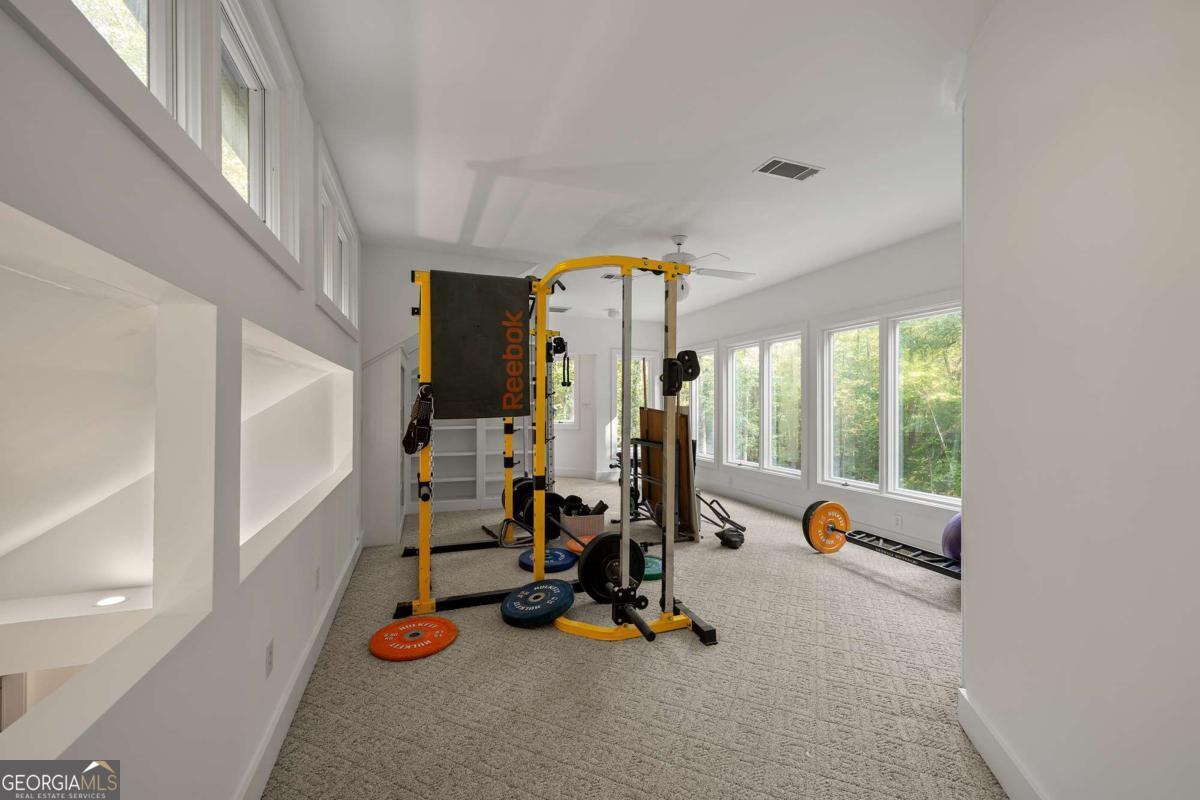 134 Tanner Bluff Athens, GA 30606 - Photo 37 of 45 a view of a room with gym equipment