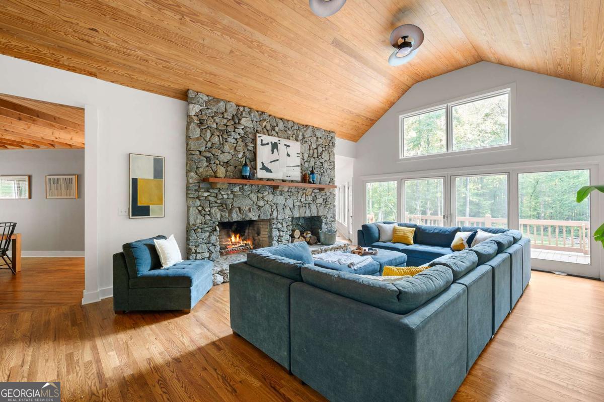 134 Tanner Bluff Athens, GA 30606 - Photo 40 of 45 a living room with fireplace furniture and a large window