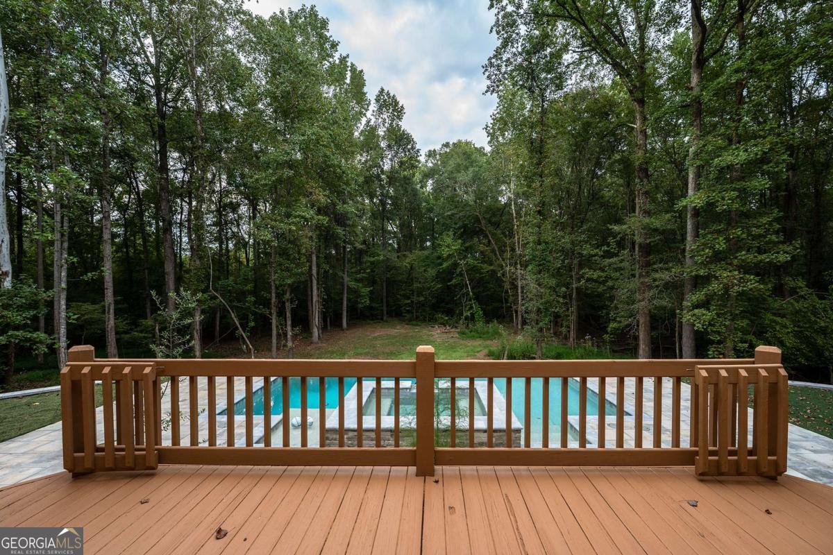 134 Tanner Bluff Athens, GA 30606 - Photo 4 of 45 a wooden deck with trees in the background
