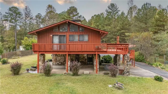 a view of a house with a yard patio and a yard
