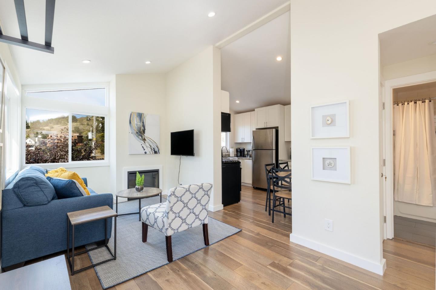 472 Lewis Lane Pacifica, CA 94044 - Photo 12 of 23 a living room with furniture and a flat screen tv