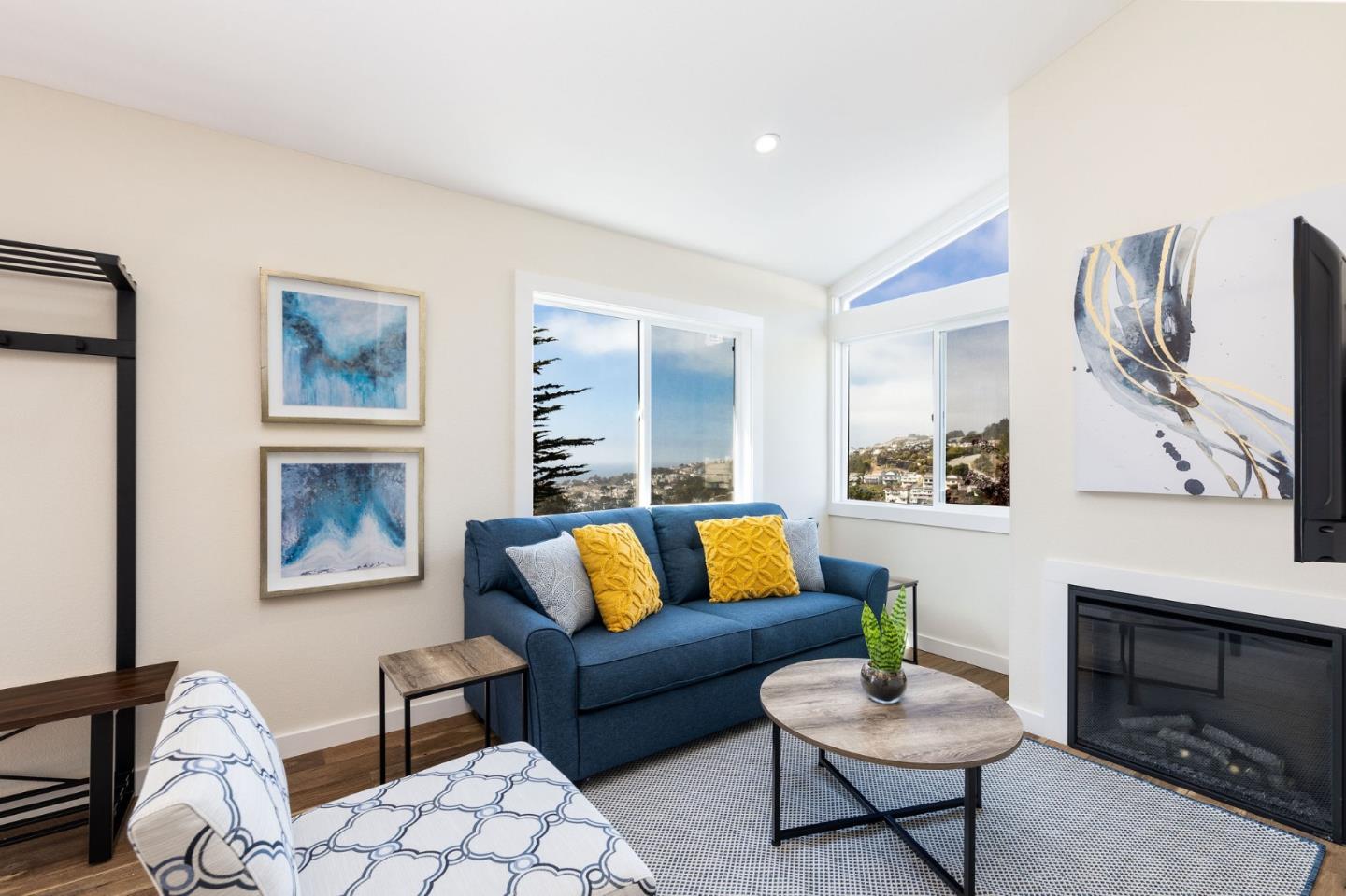 472 Lewis Lane Pacifica, CA 94044 - Photo 13 of 23 a living room with furniture and a fireplace