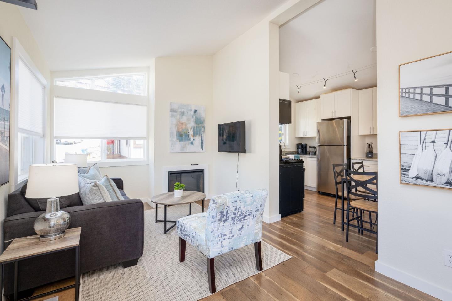 472 Lewis Lane Pacifica, CA 94044 - Photo 18 of 23 a living room with fireplace furniture and a wooden floor