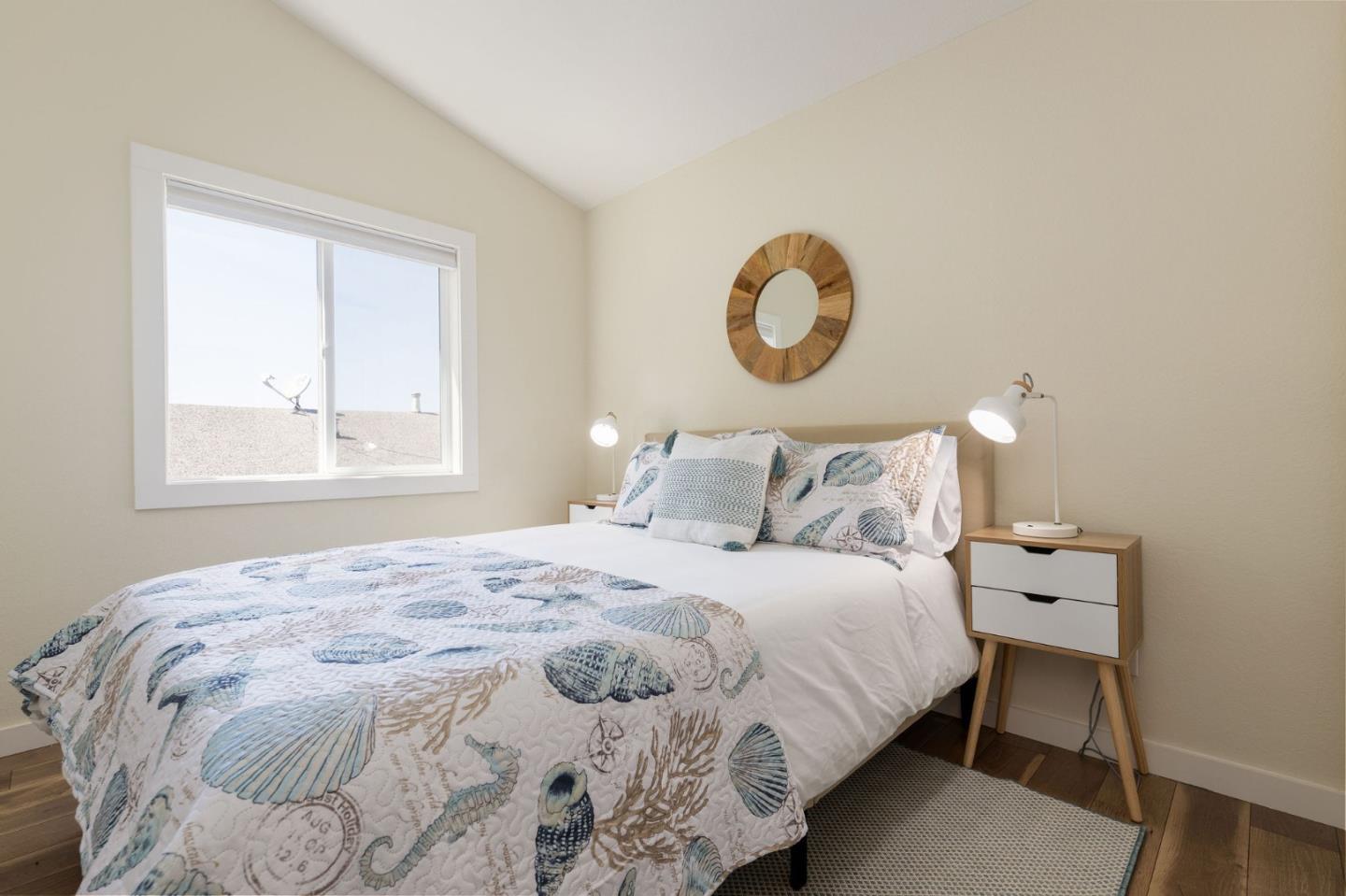 472 Lewis Lane Pacifica, CA 94044 - Photo 20 of 23 a bedroom with a bed and window