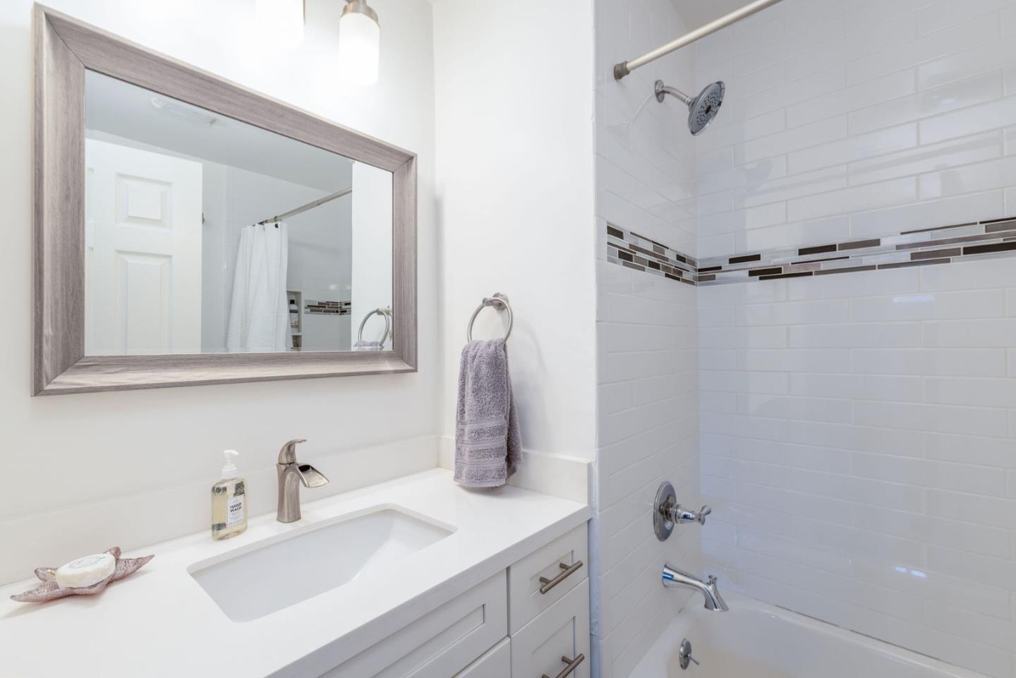472 Lewis Lane Pacifica, CA 94044 - Photo 21 of 23 a bathroom with a sink vanity and tub