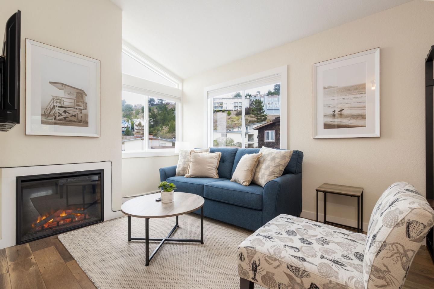 472 Lewis Lane Pacifica, CA 94044 - Photo 6 of 23 a living room with furniture a window and a fireplace
