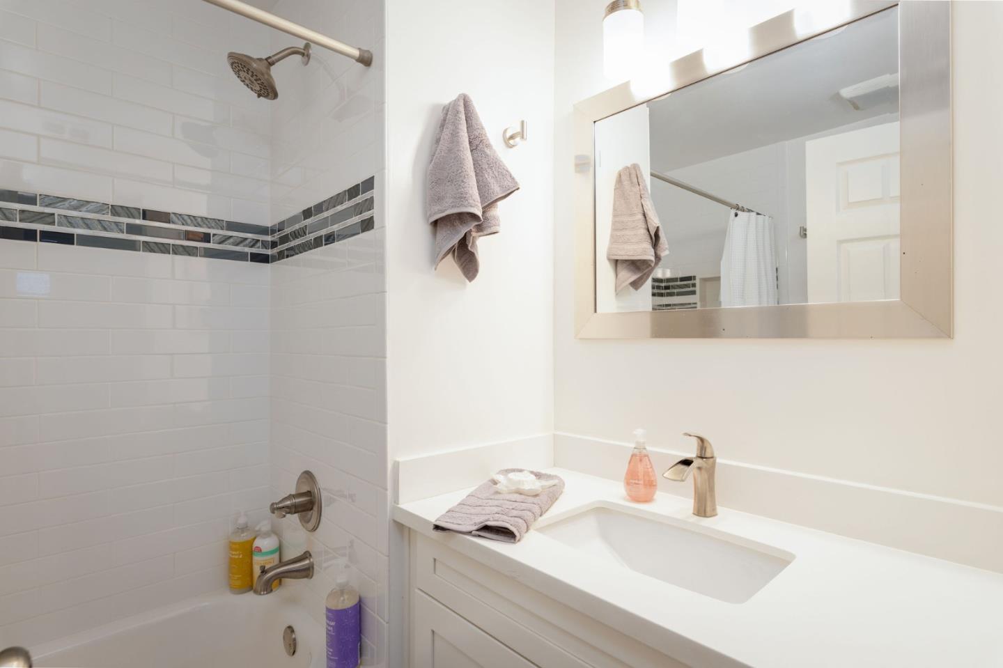 472 Lewis Lane Pacifica, CA 94044 - Photo 8 of 23 a bathroom with a sink and a mirror
