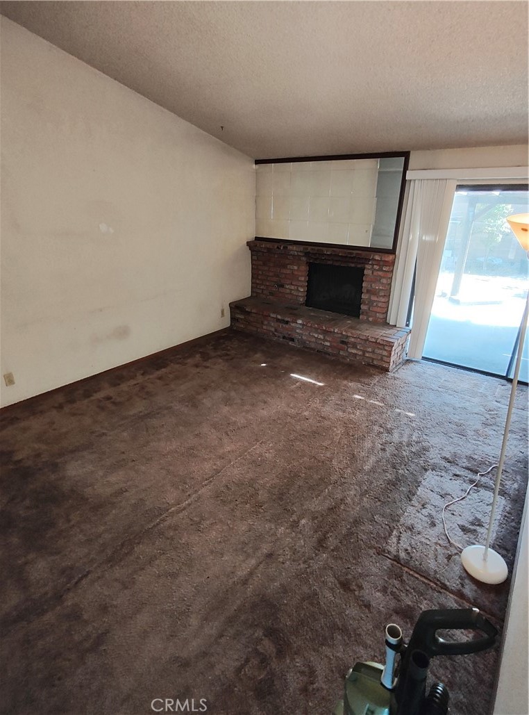 8855 Oneida Avenue Sun Valley, CA 91352 - Photo 12 of 22 a view of empty room with fireplace and window