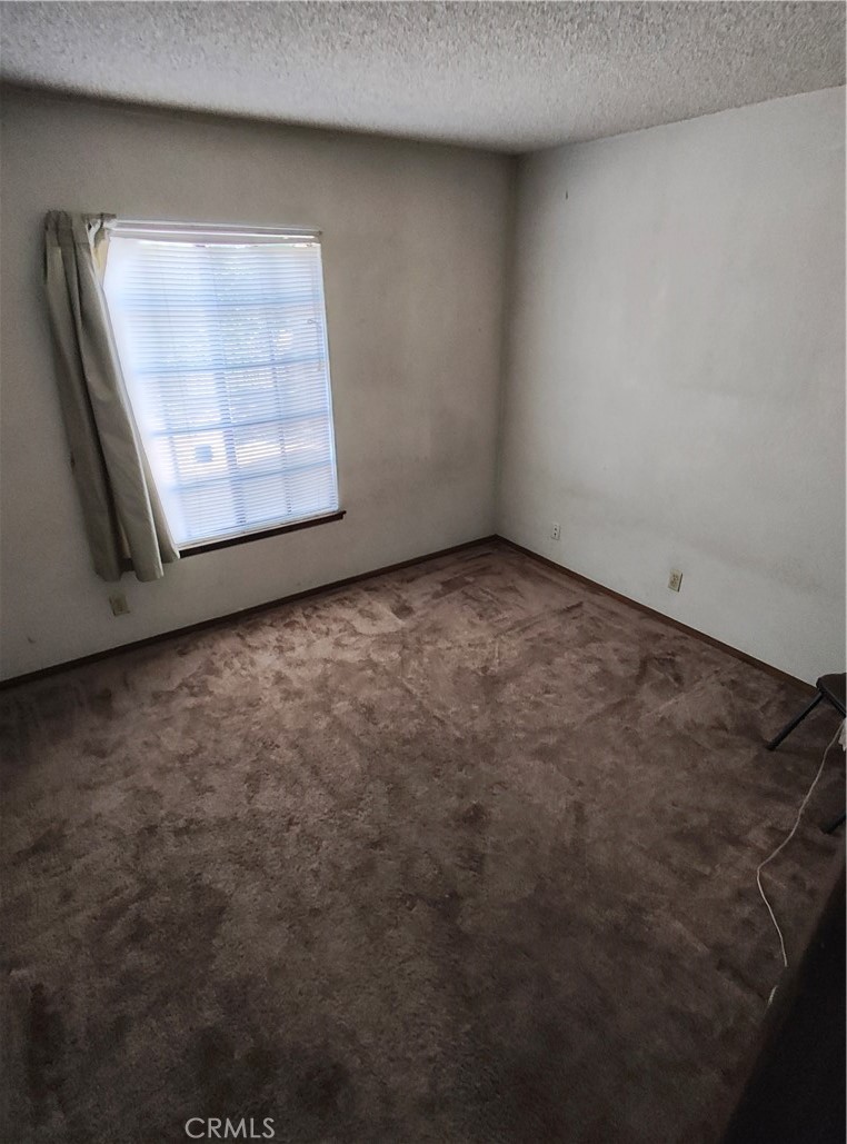 8855 Oneida Avenue Sun Valley, CA 91352 - Photo 14 of 22 an empty room with windows