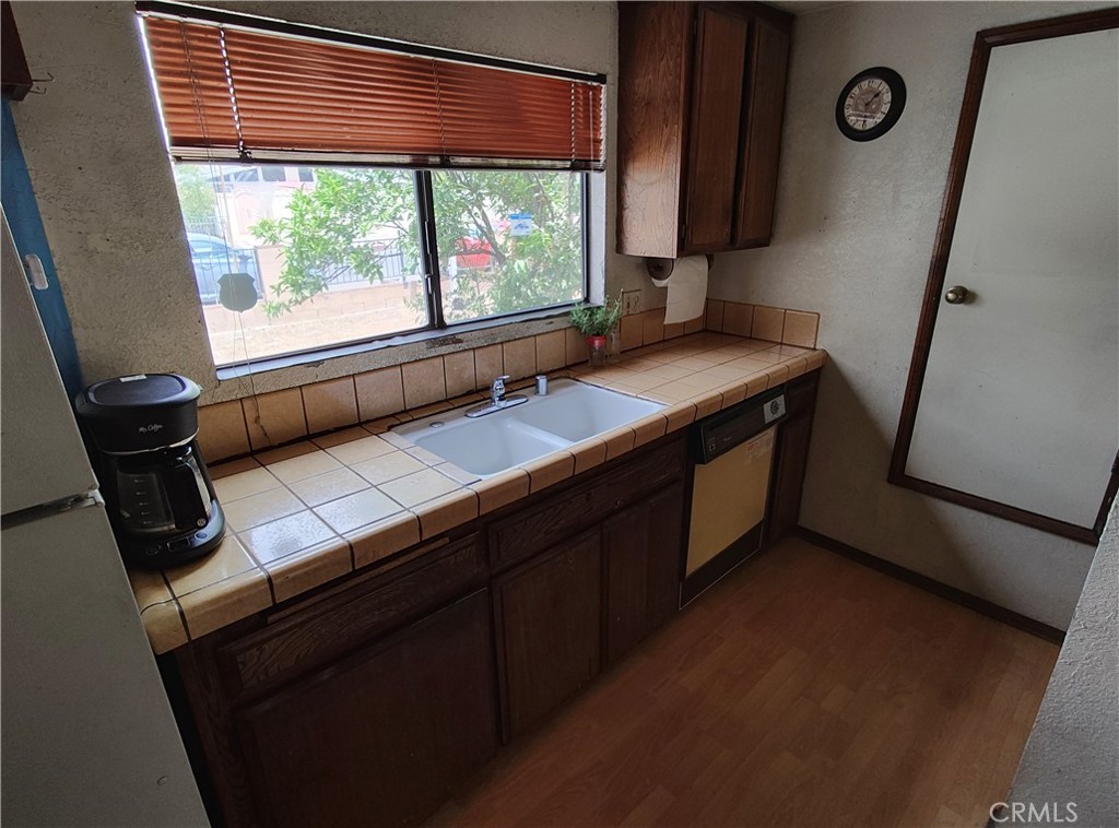 8855 Oneida Avenue Sun Valley, CA 91352 - Photo 18 of 22 a bathroom with a sink a mirror and a window