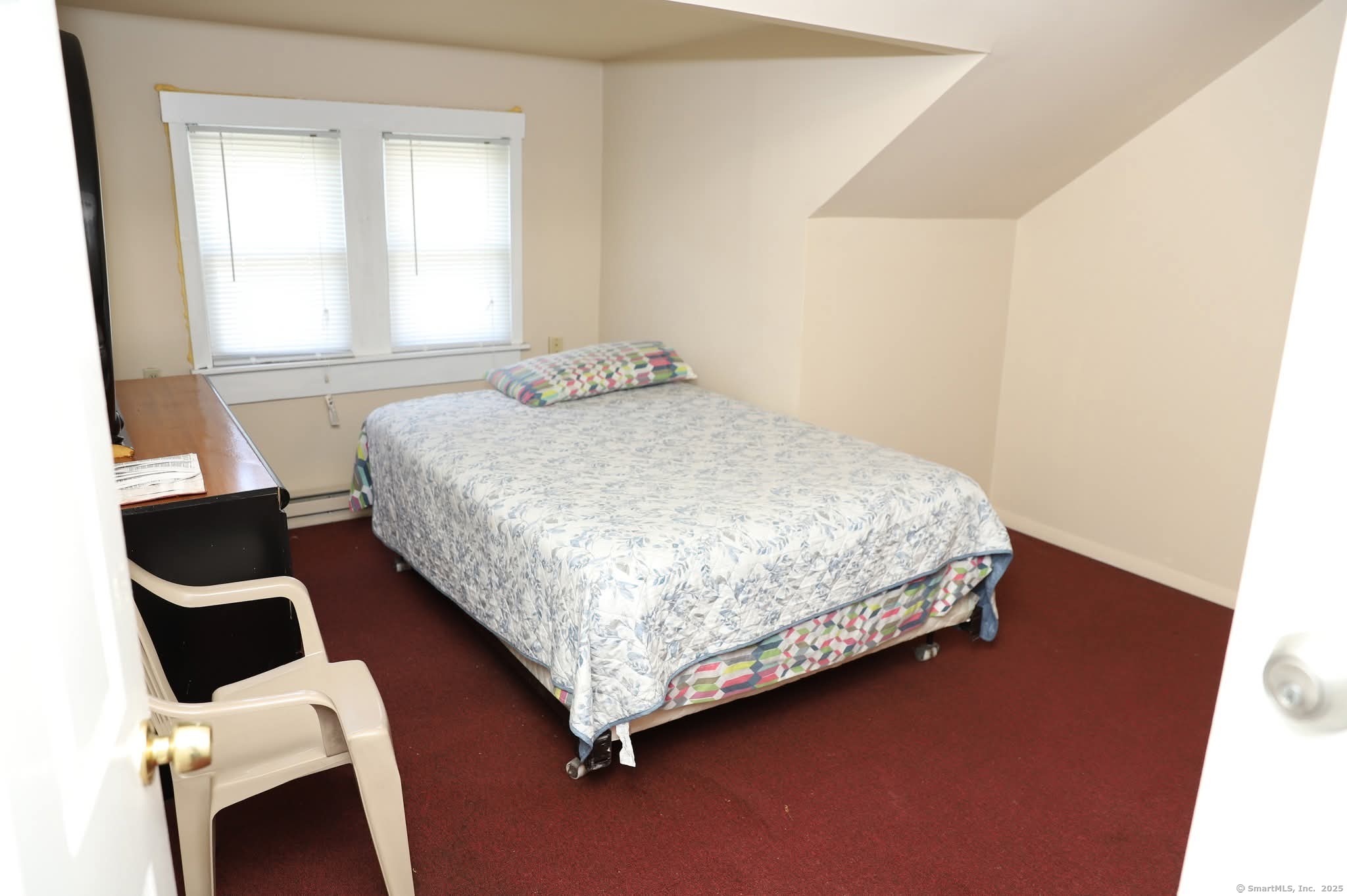 11 Pershing Street Hartford, CT 06112 - Photo 23 of 37 a bedroom with a bed and a window