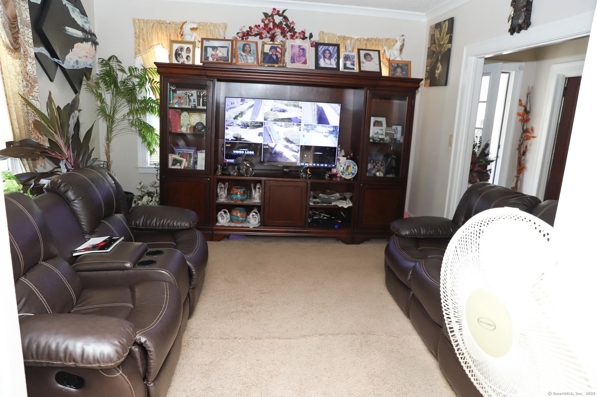 11 Pershing Street Hartford, CT 06112 - Photo 25 of 37 a living room with furniture and a flat screen tv