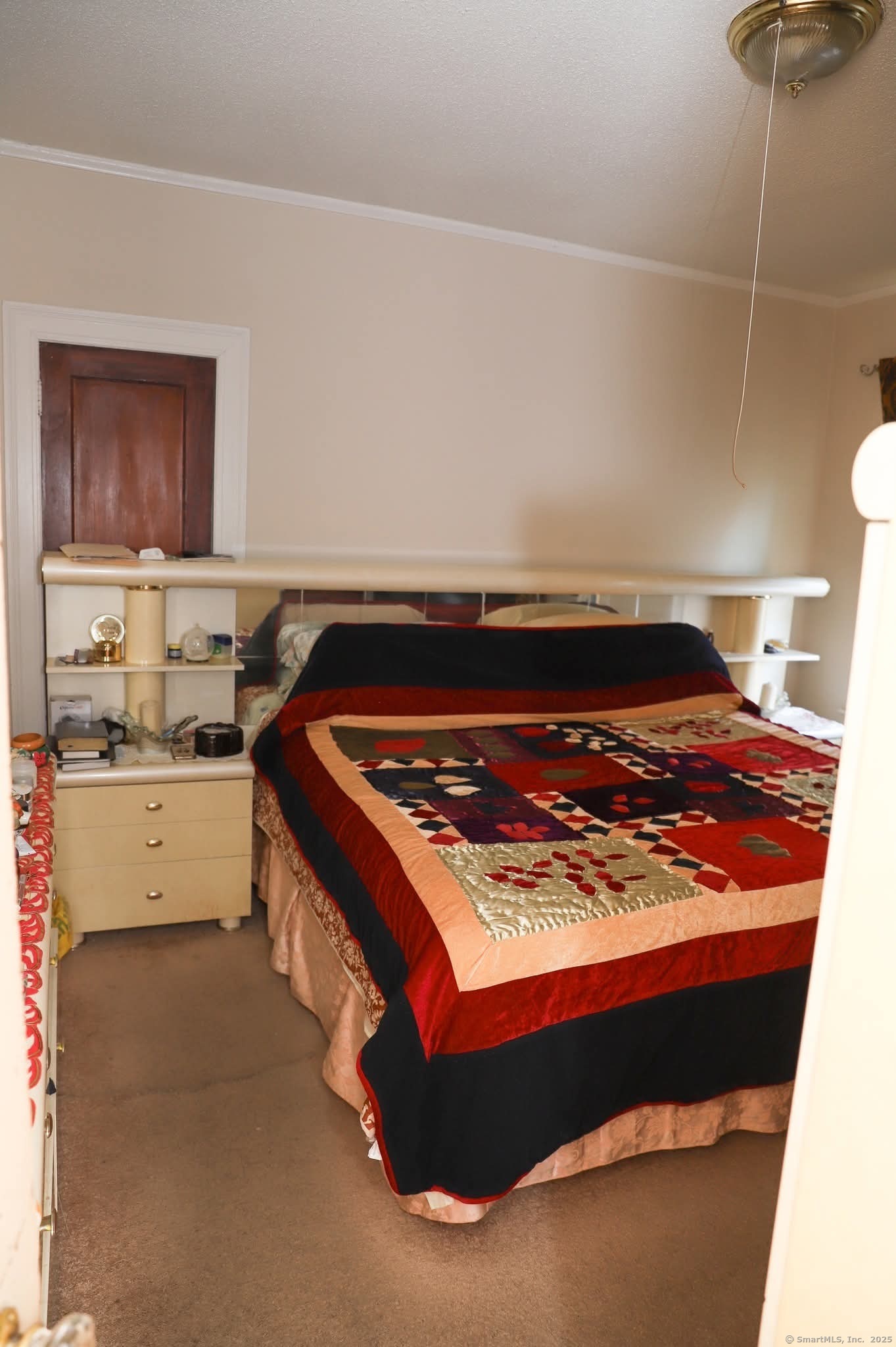 11 Pershing Street Hartford, CT 06112 - Photo 10 of 37 a bed sitting in a kitchen next to a cabinet