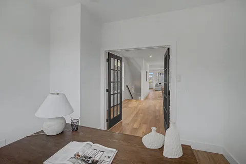 a view of a dining room with furniture window and wooden floor