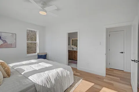 a bathroom with a double vanity sink mirror and shower