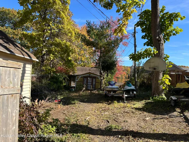 a view of a backyard of the house