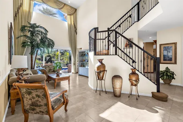 a kitchen with a large window cabinets and stainless steel appliances
