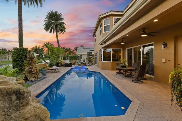 a view of a living room and a swimming pool