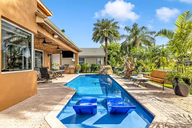 a bedroom with a bed couch and dresser