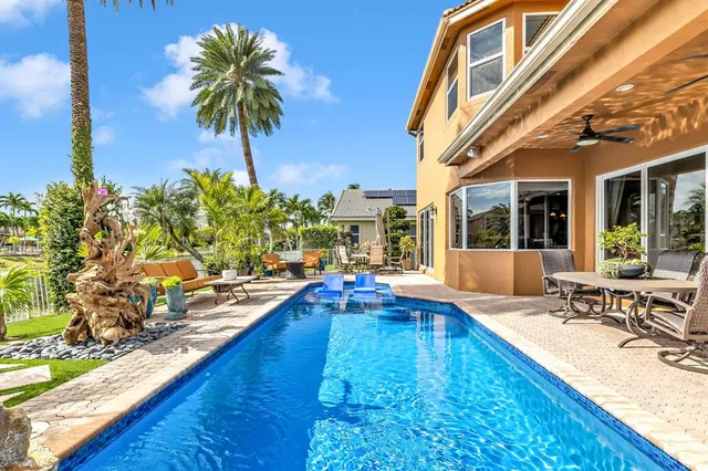 a bathroom with a double vanity sink mirror and bathtub