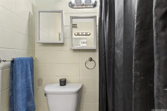 a bathroom with a toilet and a sink