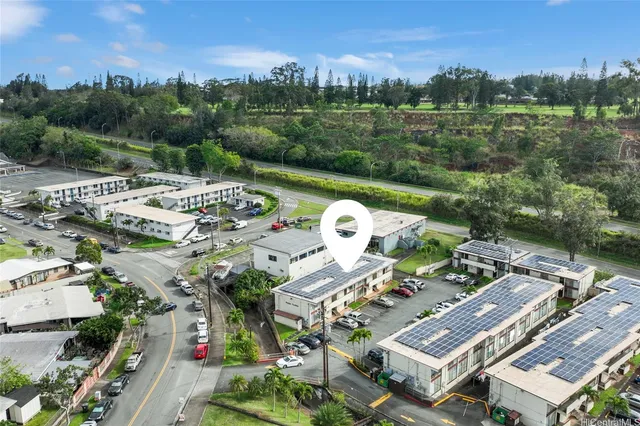 an aerial view of a house with a garden