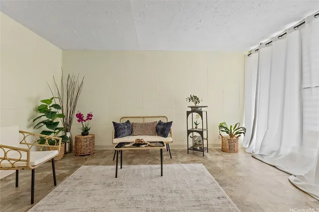 a living room with furniture and a table