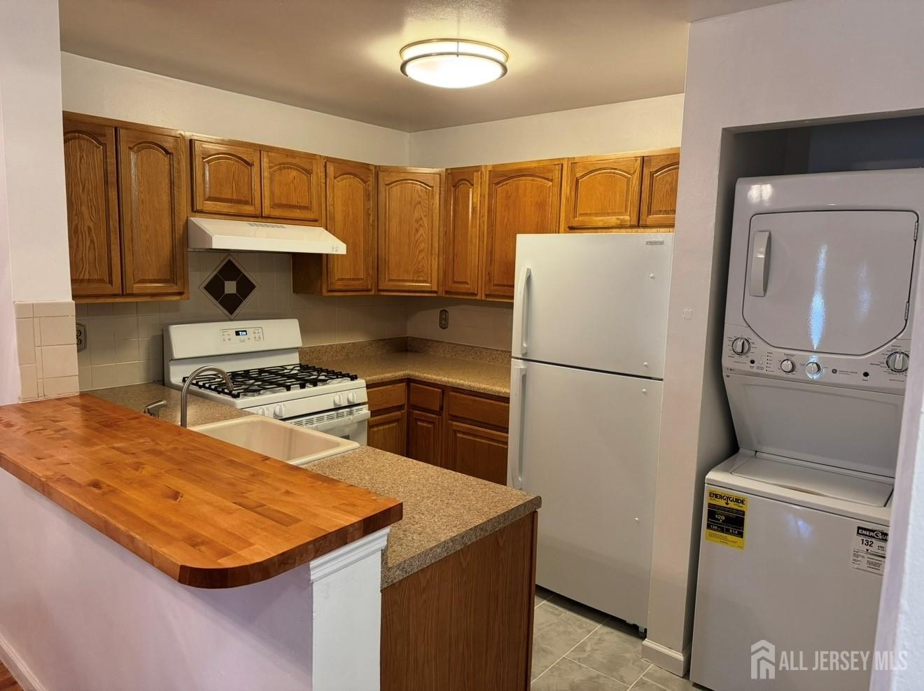 314 Edpas Road New Brunswick, NJ 08901 - Photo 6 of 8 a kitchen with a refrigerator sink and stove