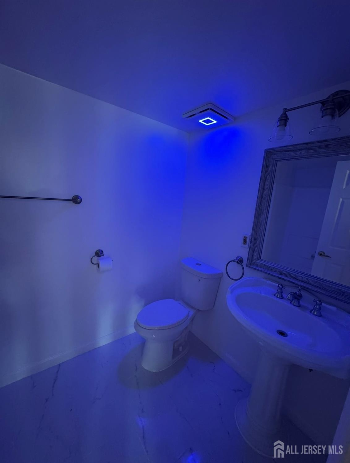 314 Edpas Road New Brunswick, NJ 08901 - Photo 8 of 8 a bathroom with a granite countertop toilet and a sink