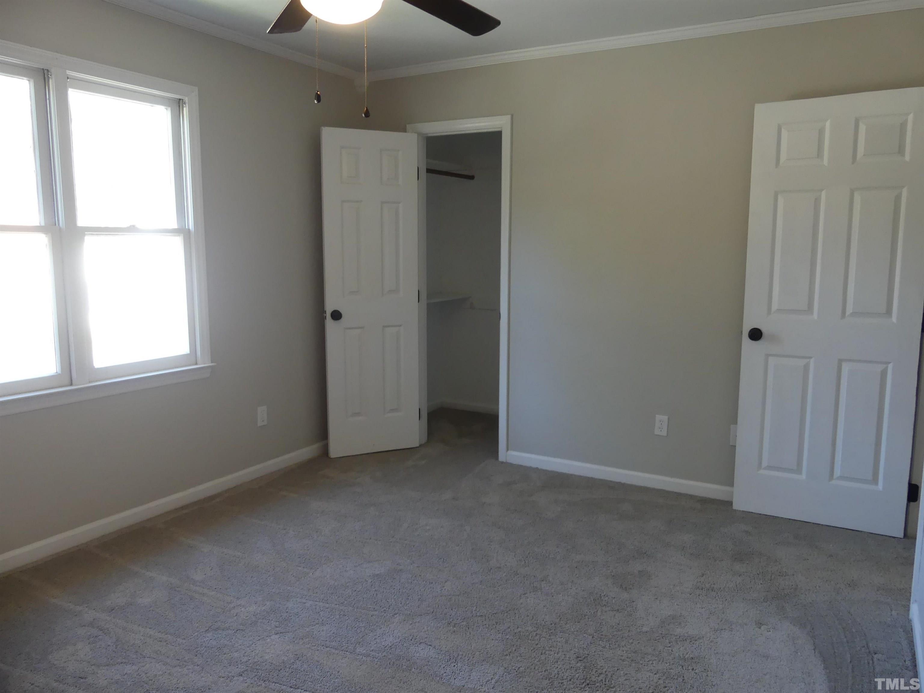6520 English Oaks Drive Raleigh, NC 27615 - Photo 11 of 21 an empty room with a window