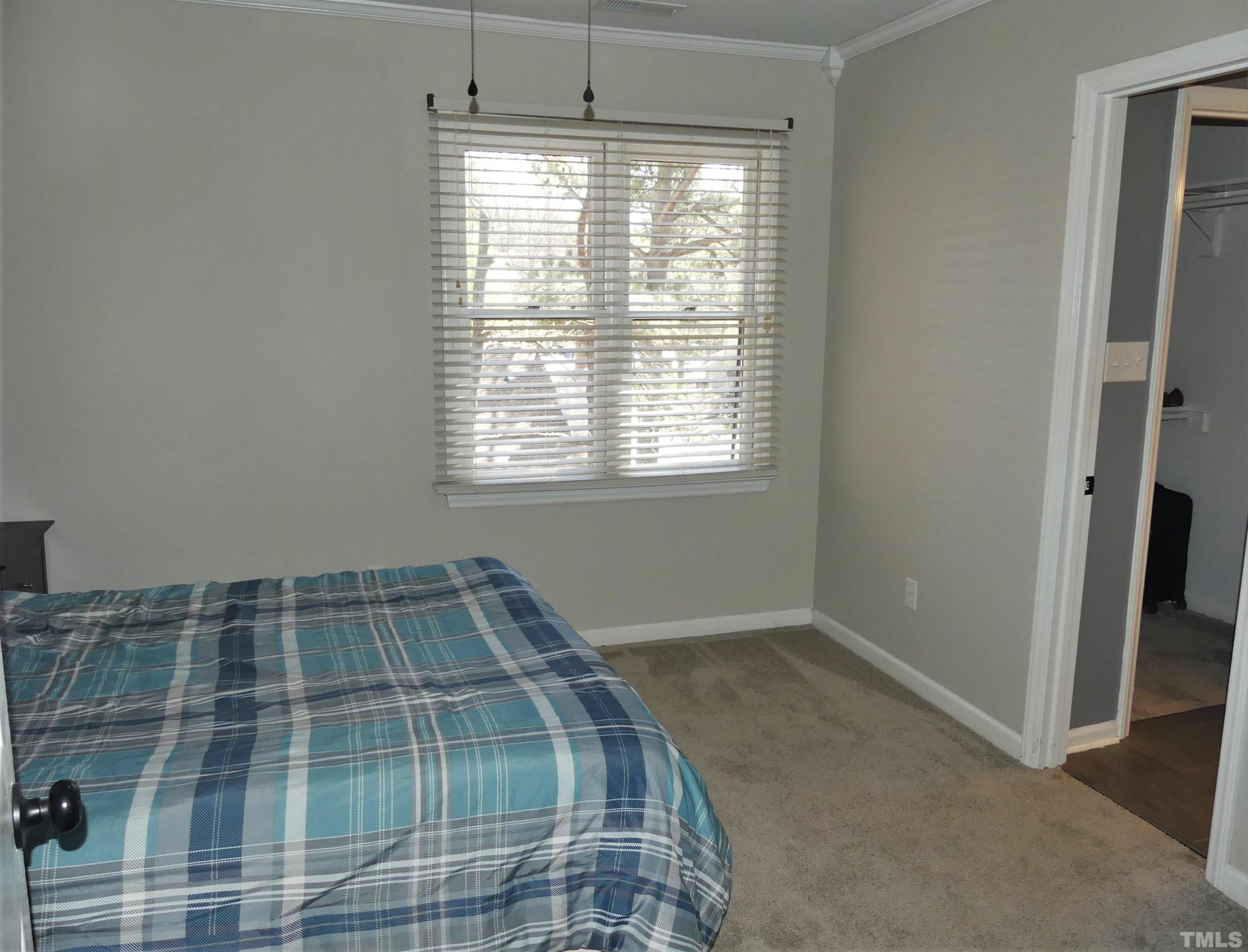 6520 English Oaks Drive Raleigh, NC 27615 - Photo 15 of 21 an empty room with a bed