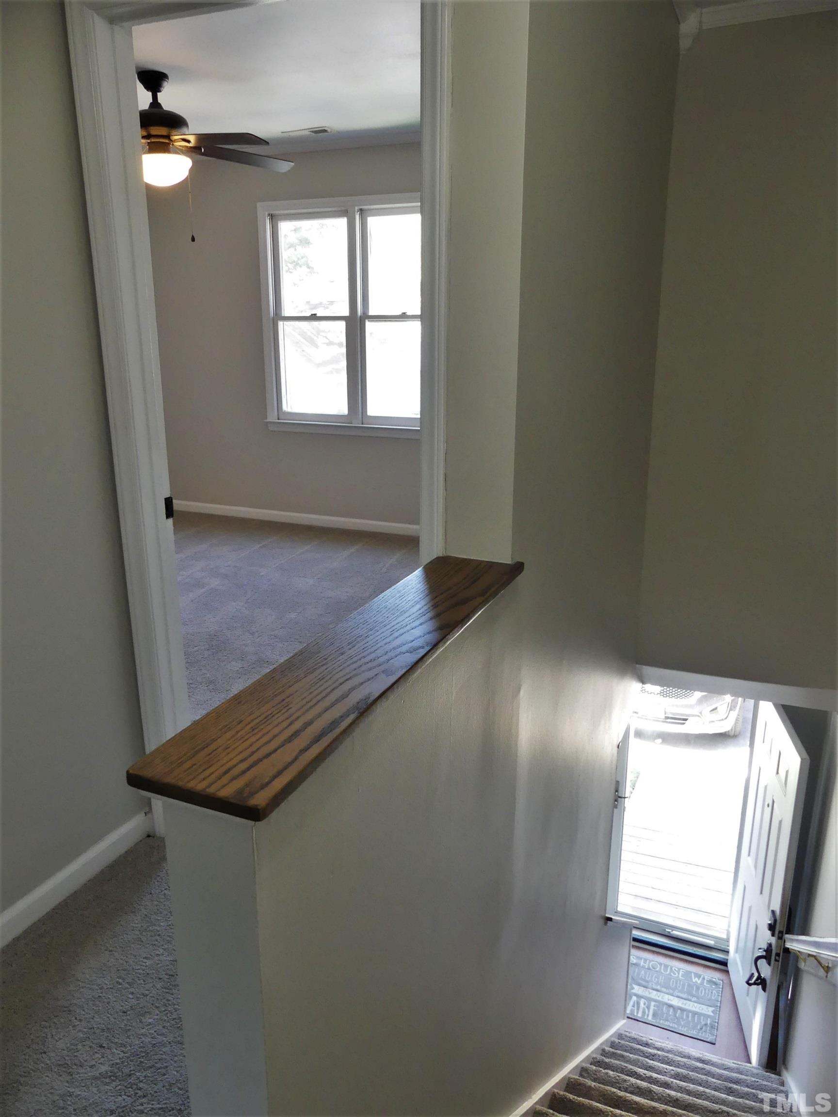 6520 English Oaks Drive Raleigh, NC 27615 - Photo 9 of 21 a view of an empty room with wooden floor and a window