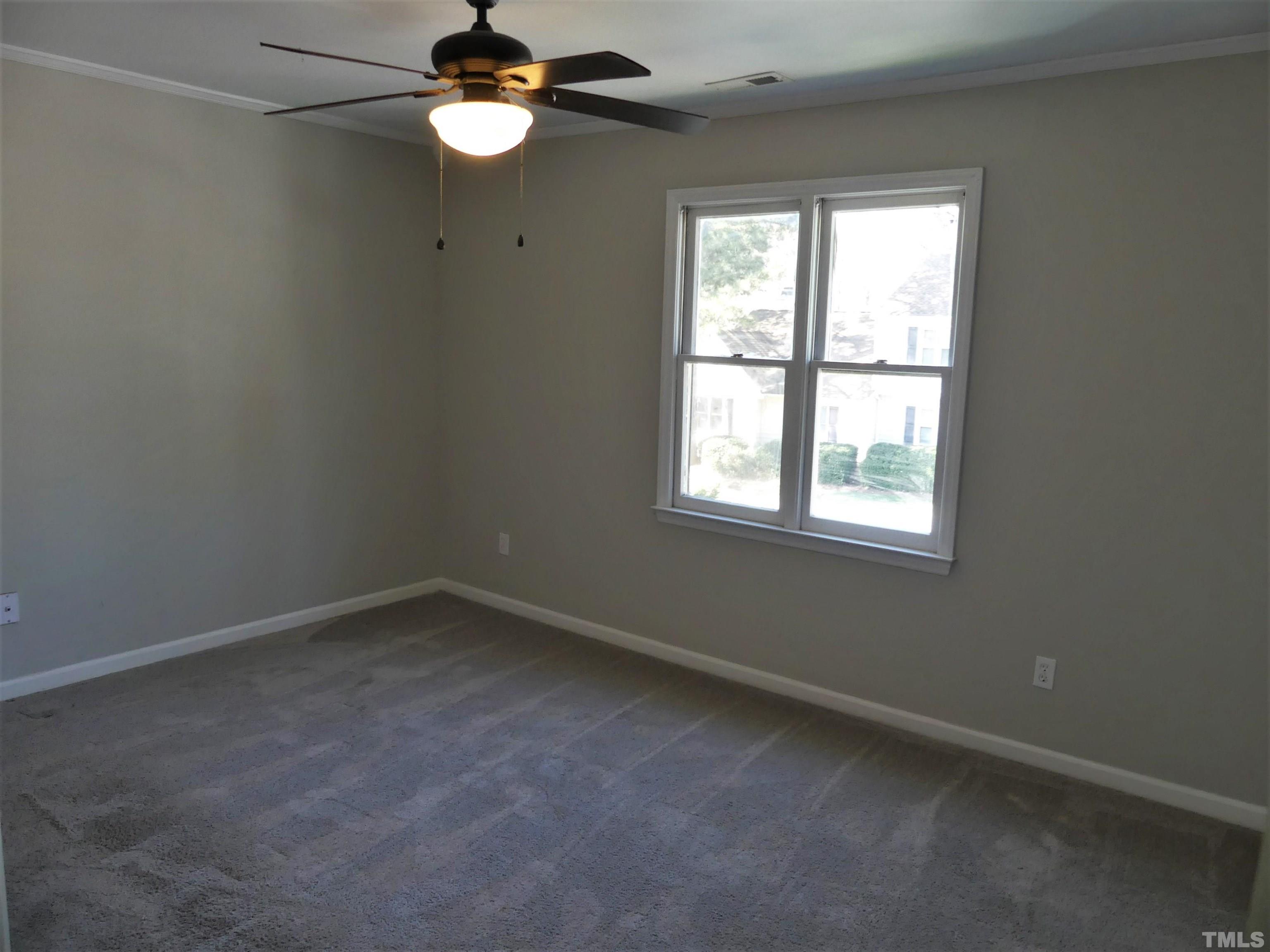 6520 English Oaks Drive Raleigh, NC 27615 - Photo 10 of 21 an empty room with a window