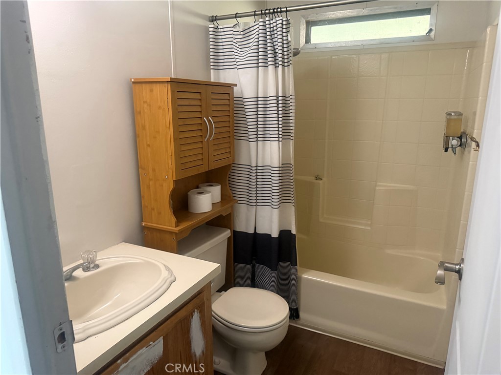 15181 Van Buren, Unit 256 Riverside, CA 92504 - Photo 14 of 34 a bathroom with a sink toilet and shower