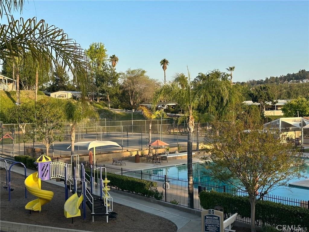 15181 Van Buren, Unit 256 Riverside, CA 92504 - Photo 23 of 34 a view of a lake with a table and chairs