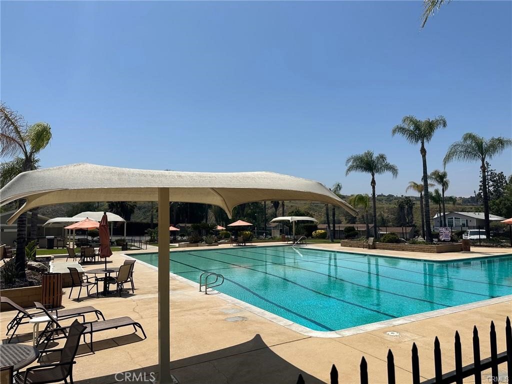 15181 Van Buren, Unit 256 Riverside, CA 92504 - Photo 29 of 34 a view of a swimming pool with furniture