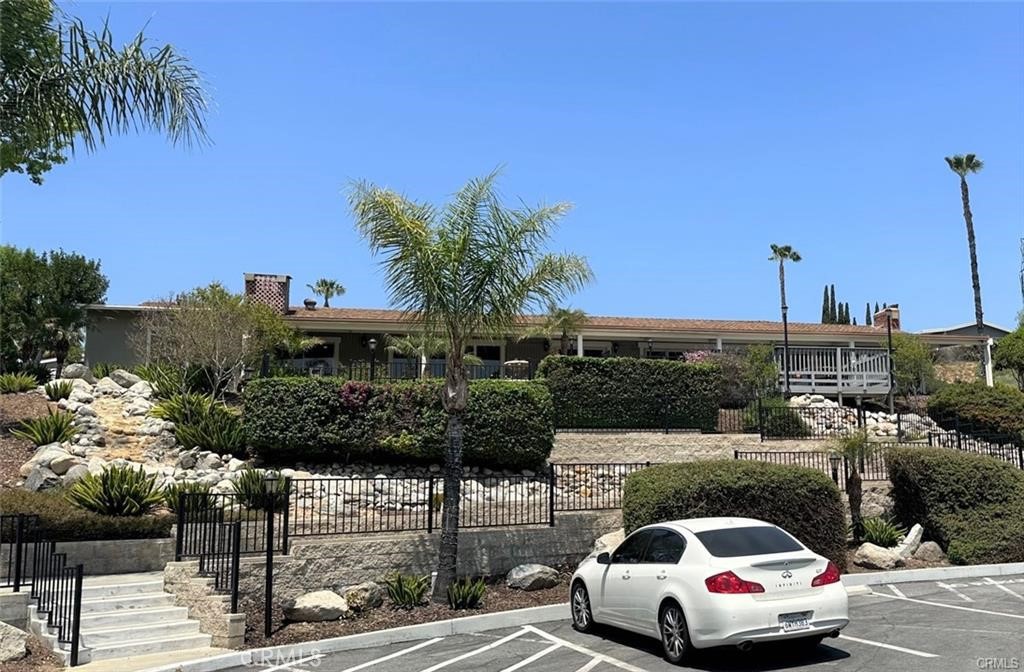 15181 Van Buren, Unit 256 Riverside, CA 92504 - Photo 31 of 34 a car parked on the side of the road