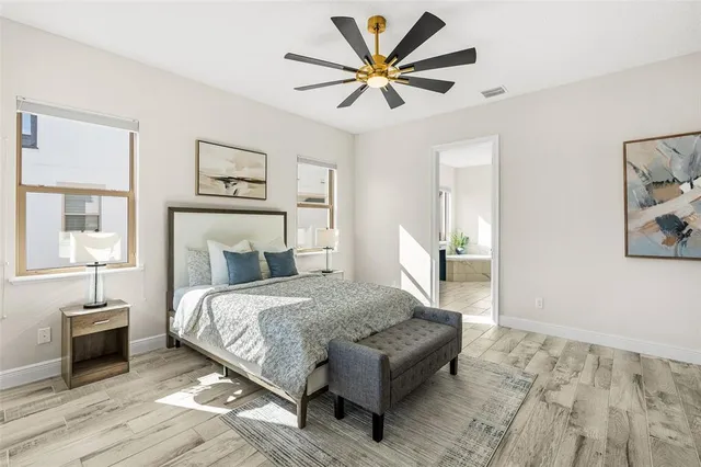 a bathroom with a shower sink vanity granite and toilet